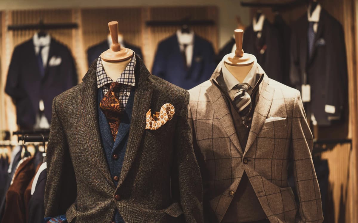 Tailored jackets on mannequins in a menswear atelier